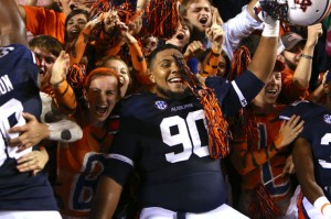 Gabe Wright celebrates in student section following victory. (c/o theAuburnVillager.com)